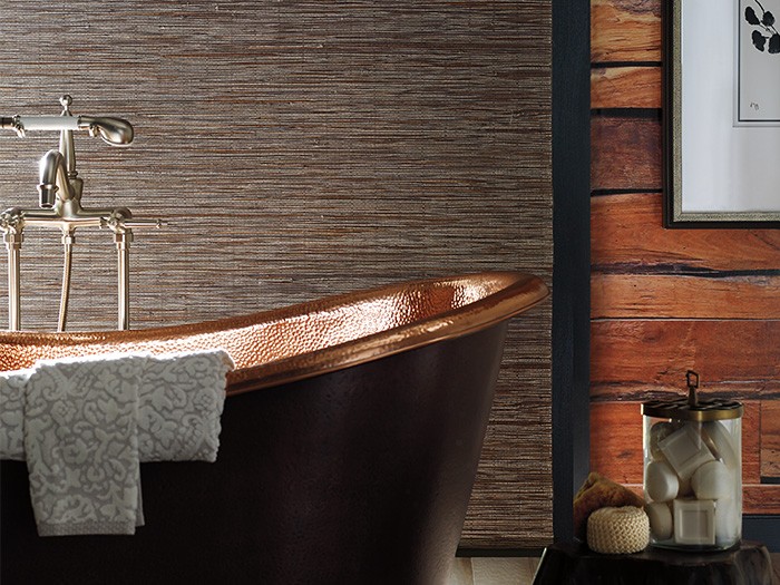 rustic bathroom with copper tub and wood accent walls